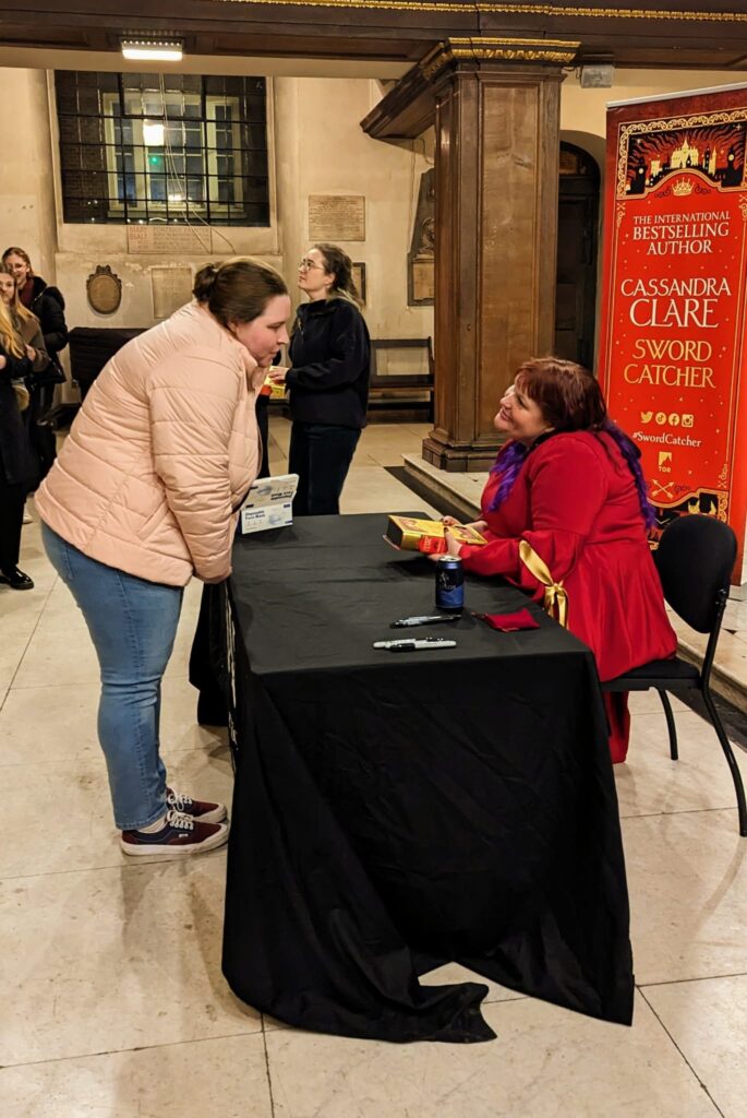 writer and reviewer Amy Leigh Chandler meeting the author of Adult high fantasy novel, Sword Catcher at London book signing. 