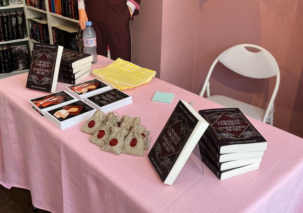Fantasy author Amy Leigh Chandler signs copies of her debut pirate fantasy, Cornelia Fairfield and the Darkened Heart.