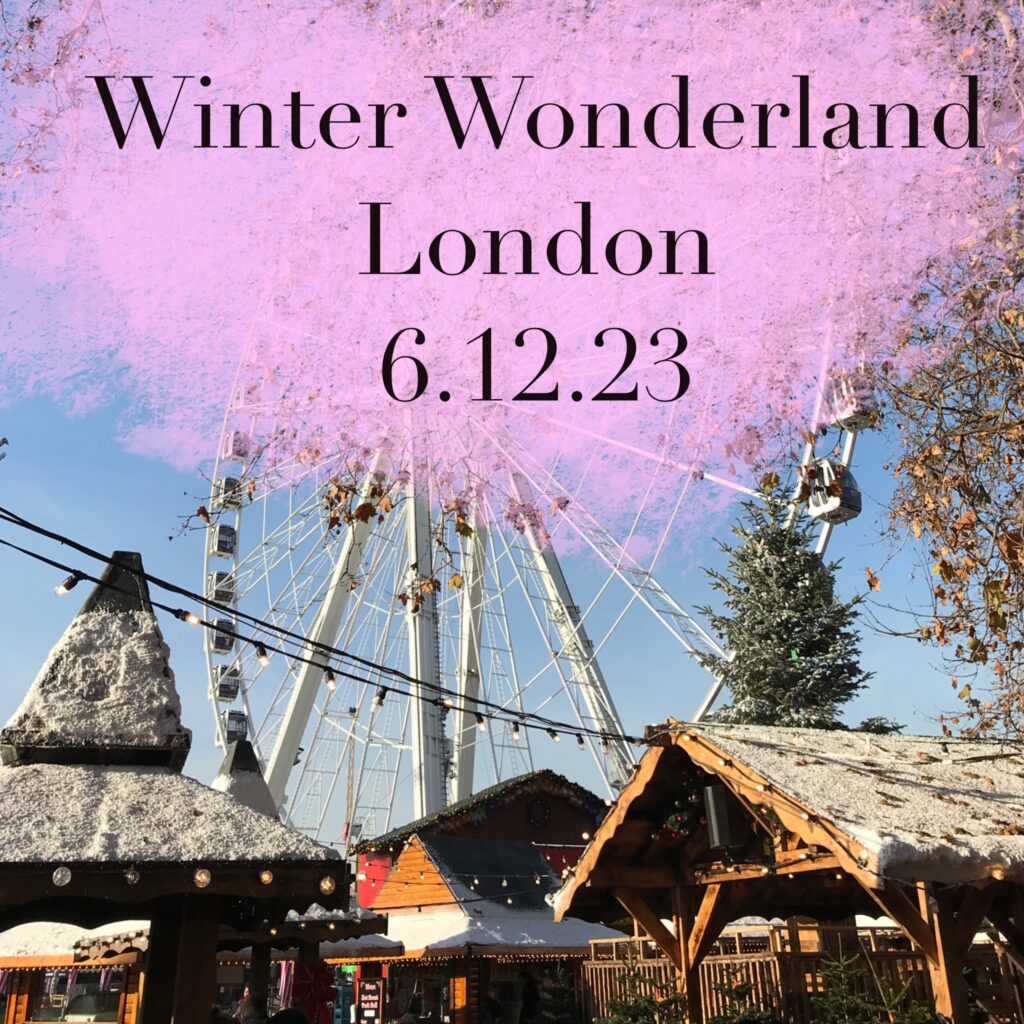 Amy Leigh Chandler reviews Hyde Park's Winter Wonderland. The image is of a Ferris wheel and wooden sheds with fake snow and string lights.