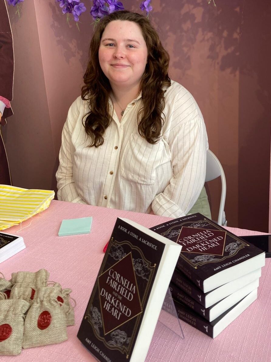 Fantasy author Amy Leigh Chandler signs copies of her debut pirate fantasy, Cornelia Fairfield and the Darkened Heart.